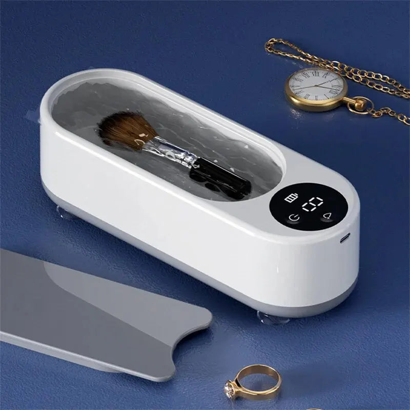 Máquina ultrassônica portátil para limpeza de joias, óculos e acessórios. Vibração de alta frequência que remove sujeira sem danificar os itens.