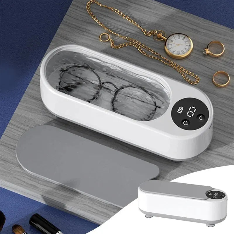 Máquina ultrassônica portátil para limpeza de joias, óculos e acessórios. Vibração de alta frequência que remove sujeira sem danificar os itens.