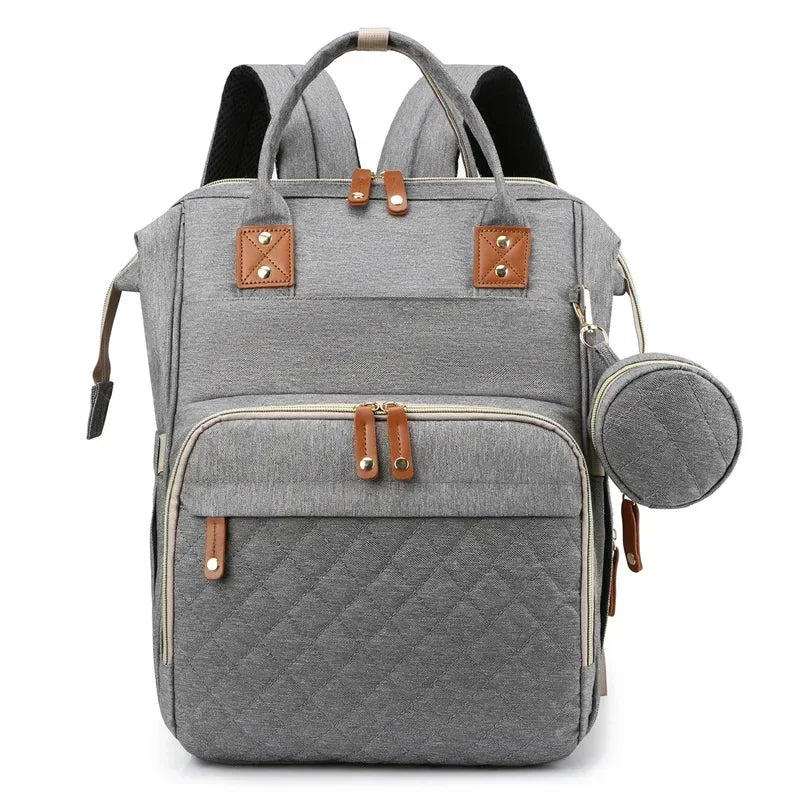 Mochila maternidade 3 em 1 com berço portátil, trocador embutido e compartimentos espaçosos para pais modernos