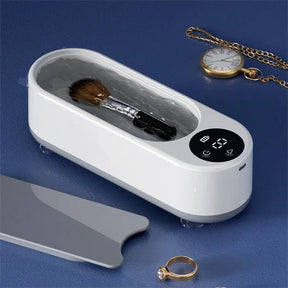 Máquina ultrassônica portátil para limpeza de joias, óculos e acessórios. Vibração de alta frequência que remove sujeira sem danificar os itens.