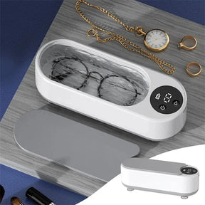 Máquina ultrassônica portátil para limpeza de joias, óculos e acessórios. Vibração de alta frequência que remove sujeira sem danificar os itens.