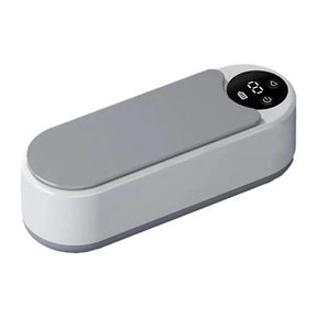 Máquina ultrassônica portátil para limpeza de joias, óculos e acessórios. Vibração de alta frequência que remove sujeira sem danificar os itens.