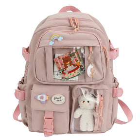 Mochila infantil feminina com estampa colorida, material leve em poliéster, alças acolchoadas confortáveis, bolsos amplos e design alegre, ideal para uso escolar.