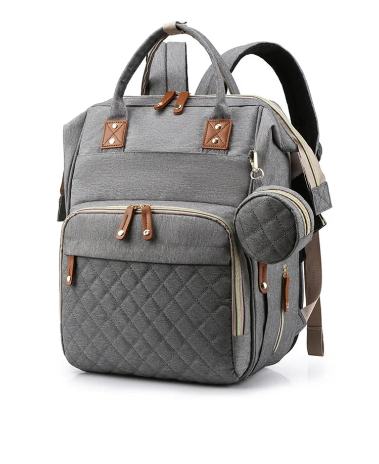 Mochila maternidade 3 em 1 que vira berço portátil prática e funcional.