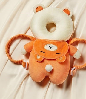 Kit proteção para bebê com almofada de cabeça e joelheiras antiderrapantes.