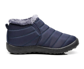 Bota feminina térmica com forro interno, solado antiderrapante e exterior impermeável. Ideal para dias frios, neve e looks de inverno com estilo.