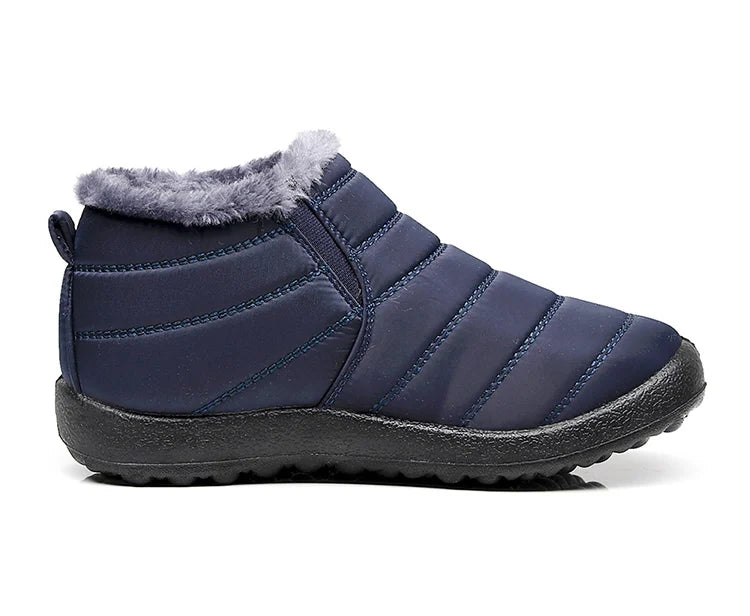 Bota feminina térmica com forro interno, solado antiderrapante e exterior impermeável. Ideal para dias frios, neve e looks de inverno com estilo.