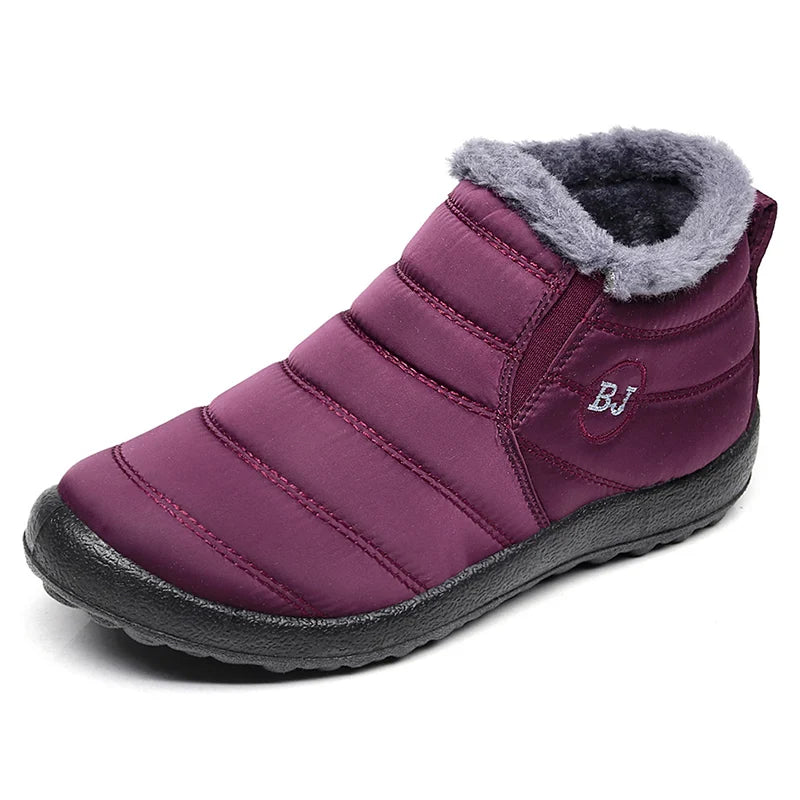 Bota feminina térmica com forro interno, solado antiderrapante e exterior impermeável. Ideal para dias frios, neve e looks de inverno com estilo.